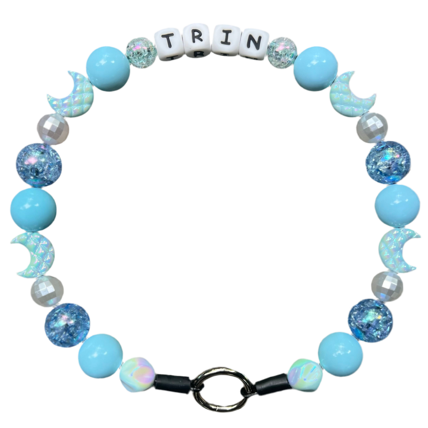 Bracelet with blue and white beads and letter tiles spelling 'TRIN' on a white background