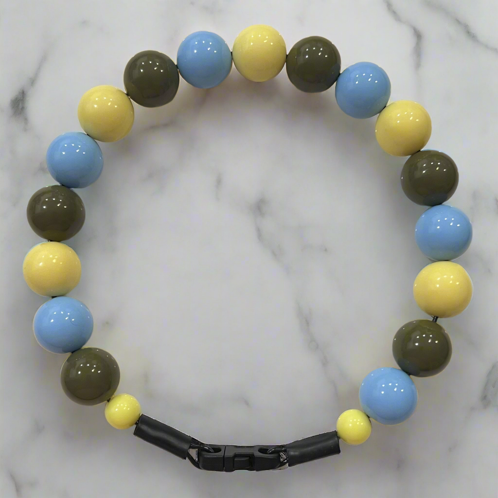 Colorful beaded necklace on a marble background