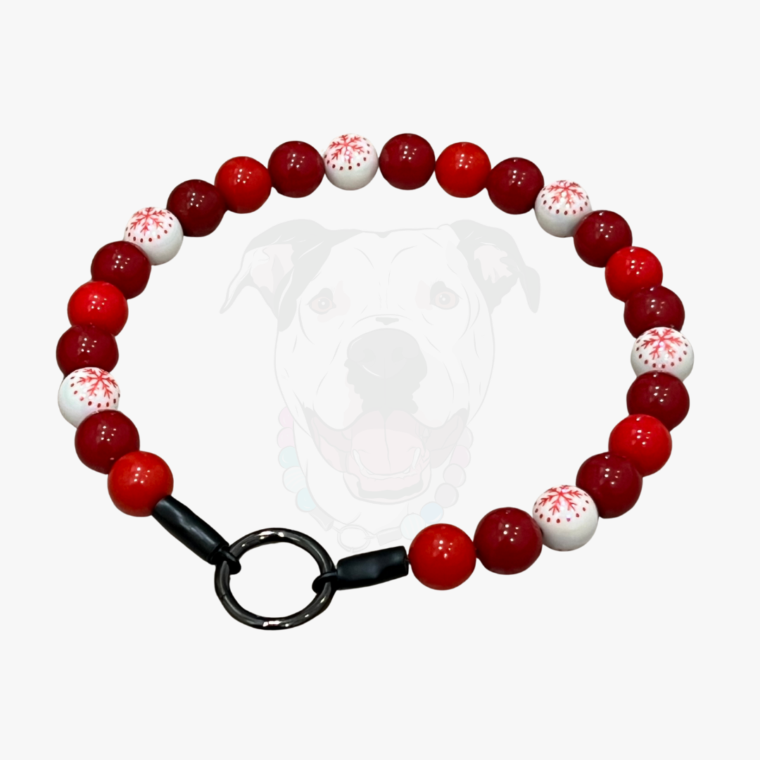 Bracelet with red and white beads on a white background