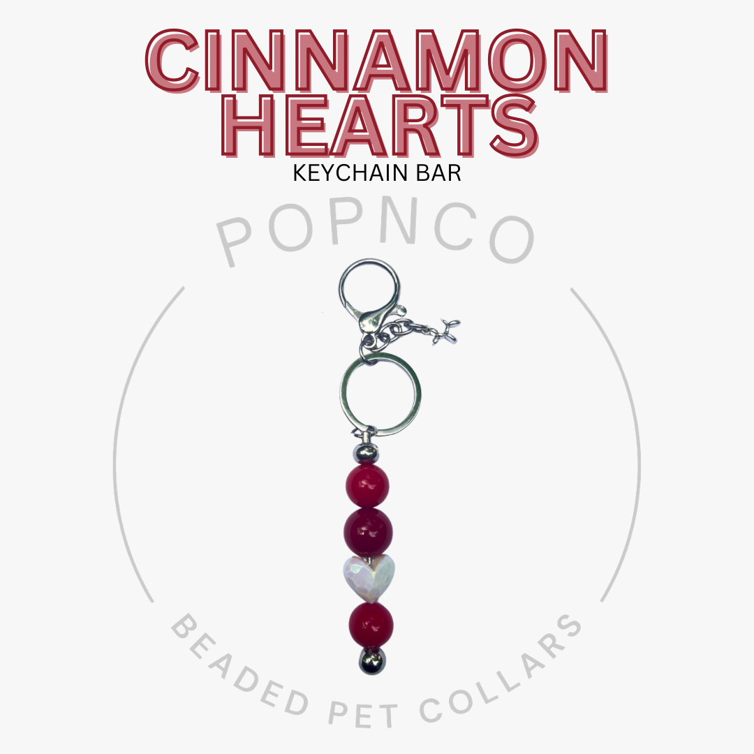 Cinnamon Hearts keychain bar with beads on a white background, featuring the brand 'Popnco'.