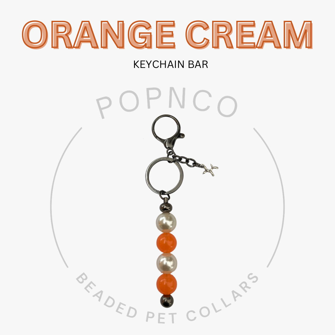 Keychain bar with orange, cream, and pearl beads on a white background with 'Orange Cream' text.