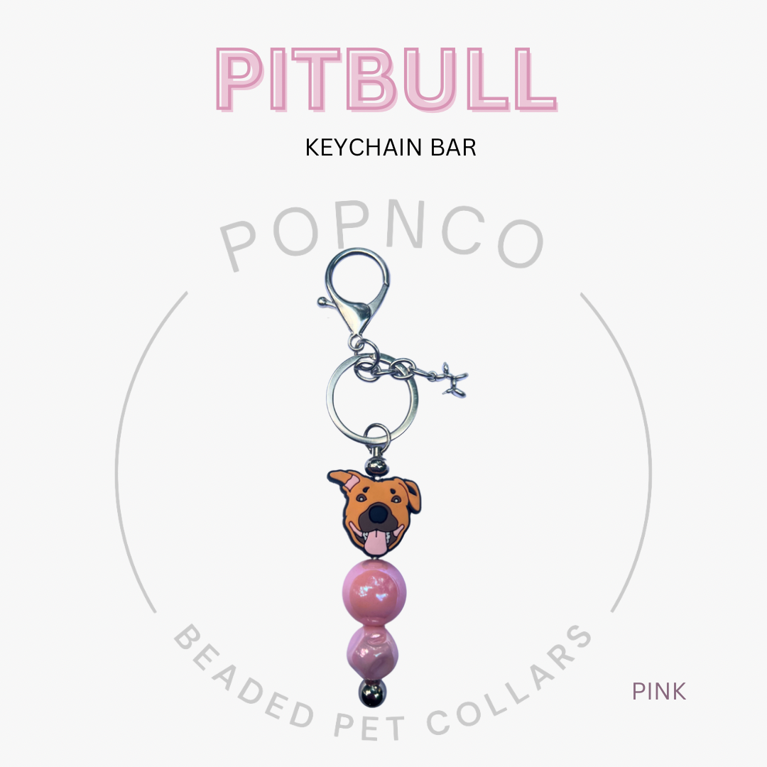 Keychain bar with pitbull charm and pink beads on a white background