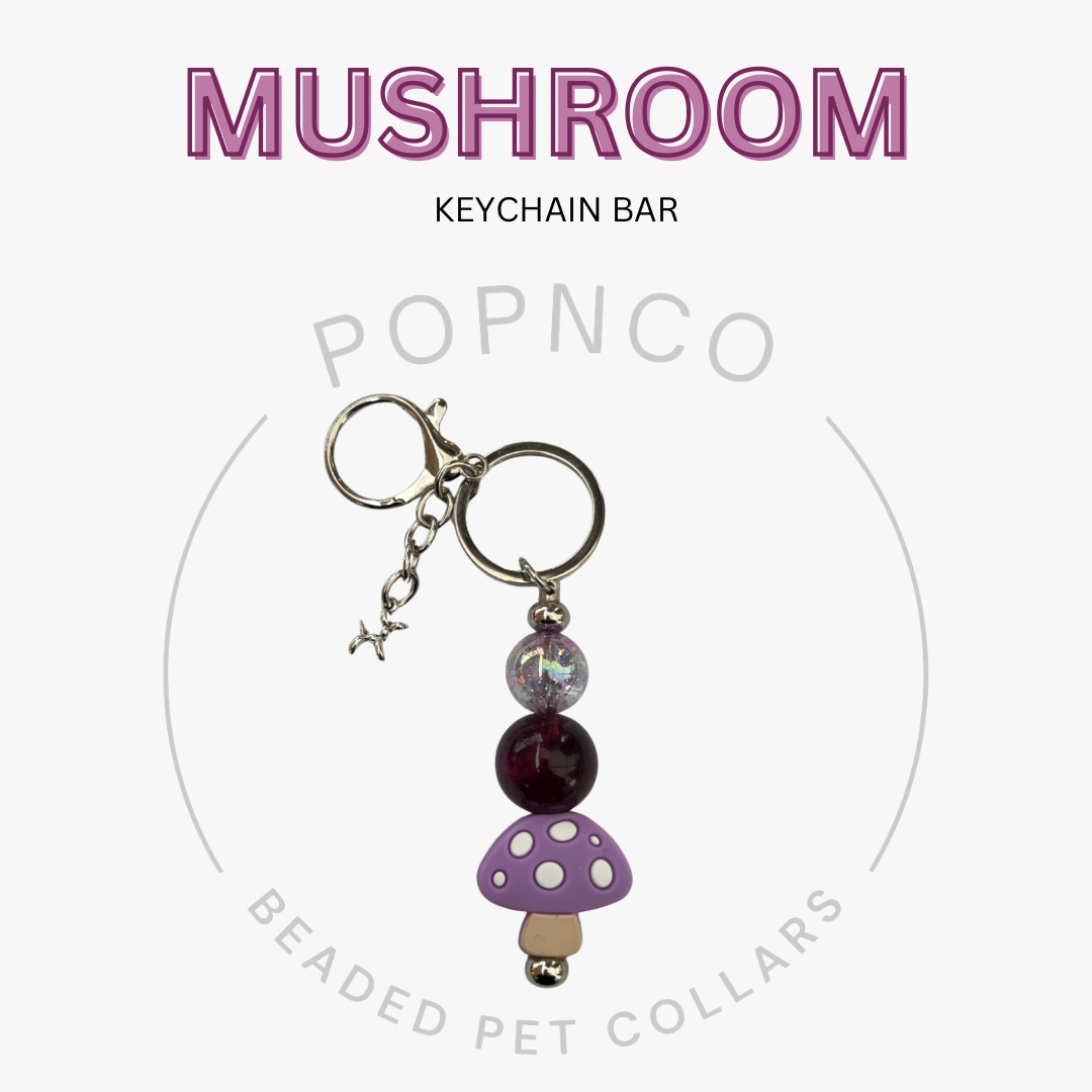 Mushroom keychain bar with beads on a white background, featuring the brand 'Popnco'.