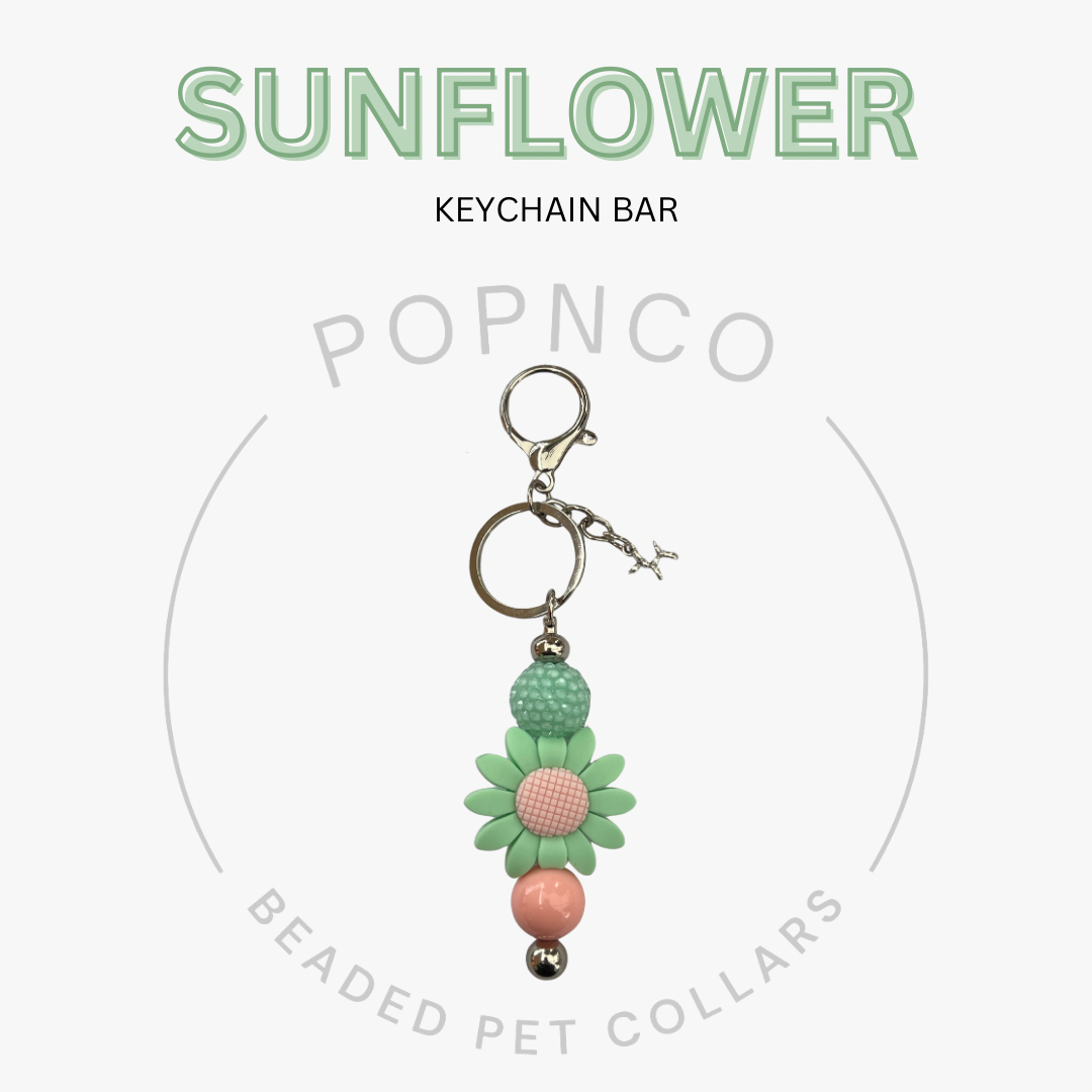 Sunflower keychain bar with beads on a white background, featuring the brand 'Popnco'.