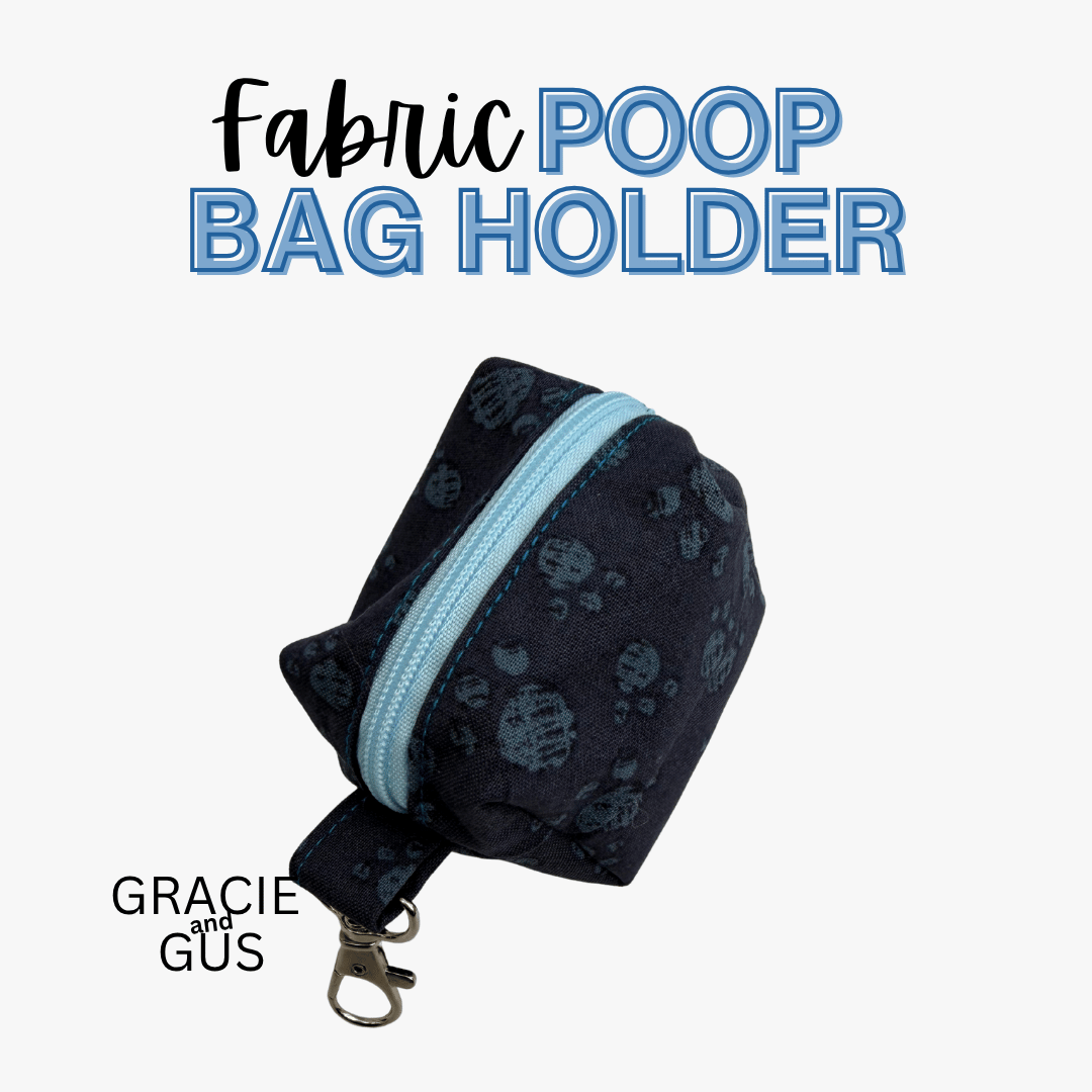 A fabric poop bag holder pouch with a dark navy blue paw-print pattern and a light blue zipper, shown on a white background with text reading 'Fabric POOP BAG HOLDER' and 'GRACIE and GUS'.