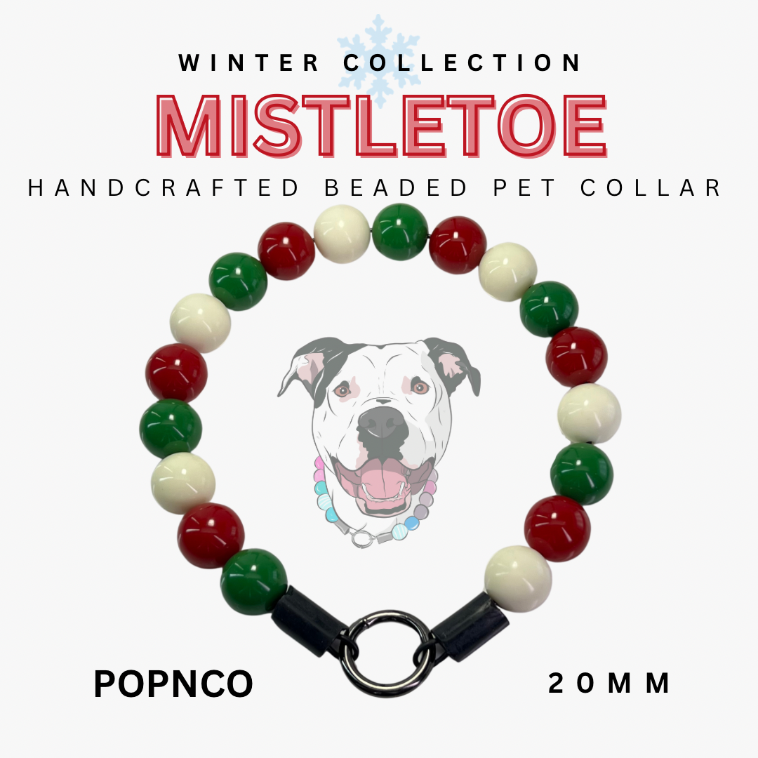 Handcrafted beaded pet collar with red, green, and white beads on a white background, featuring a dog illustration and text about the 'Mistletoe' collection.