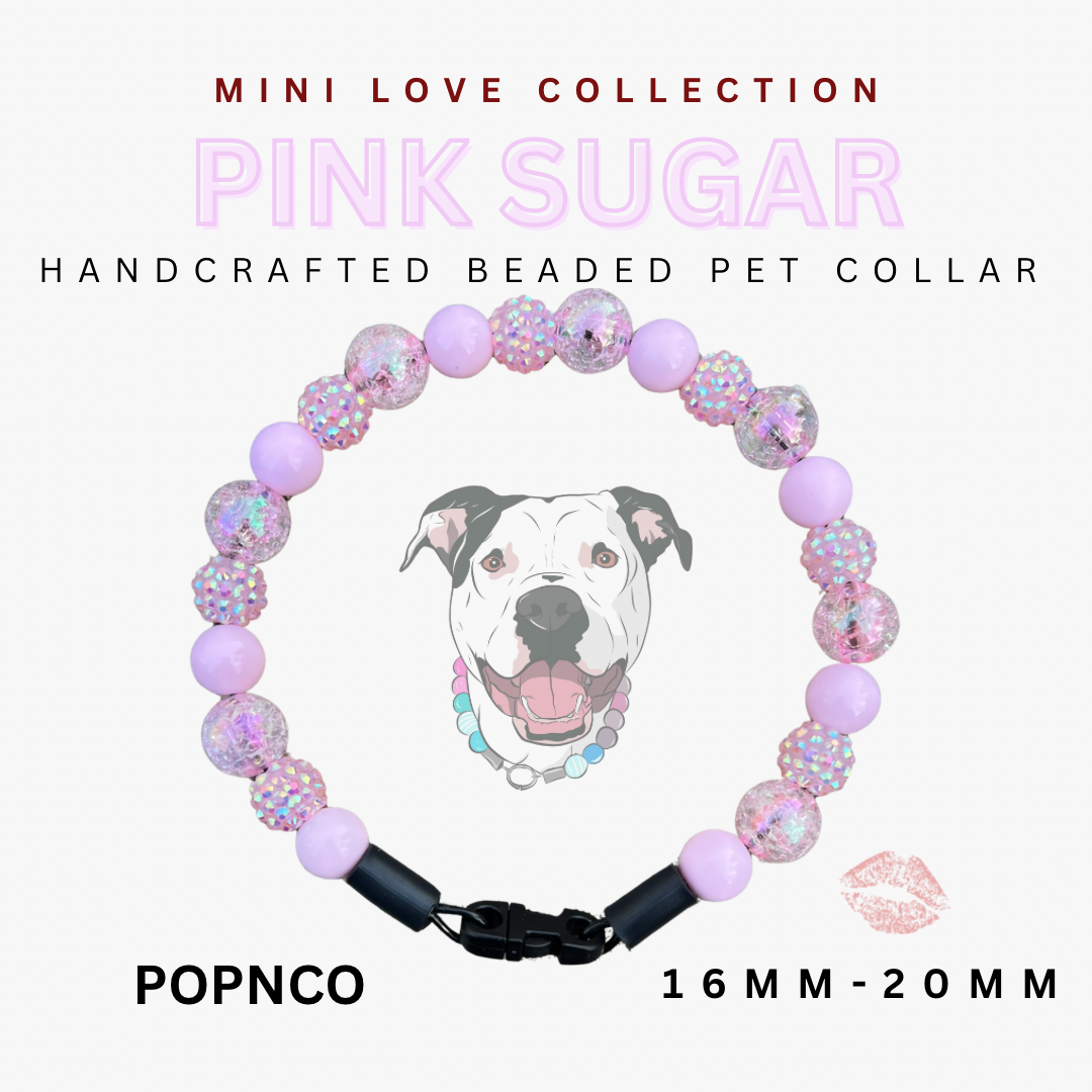 Handcrafted beaded pet collar with pink sugar design on a white background