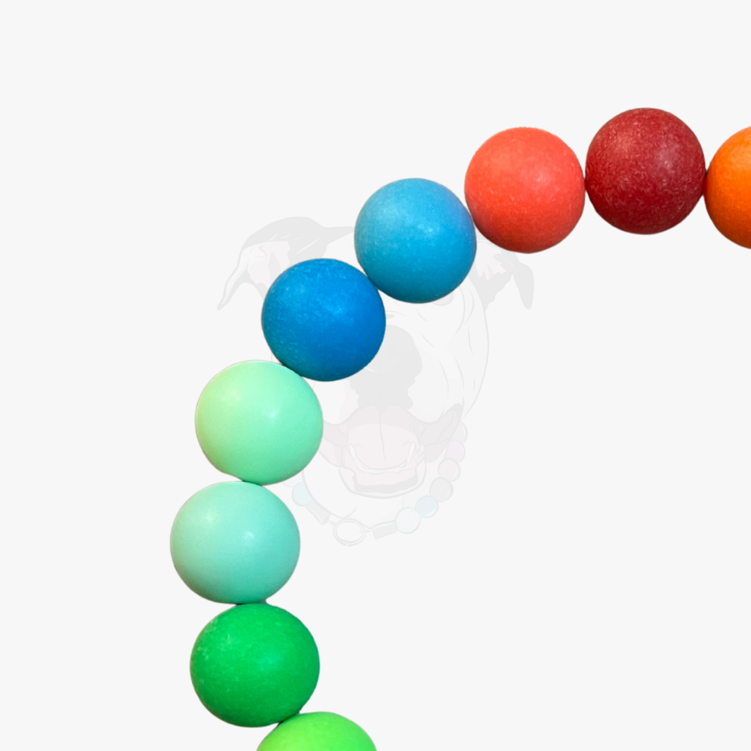 Colorful beaded necklace with blue, green, red, and orange beads on a white background