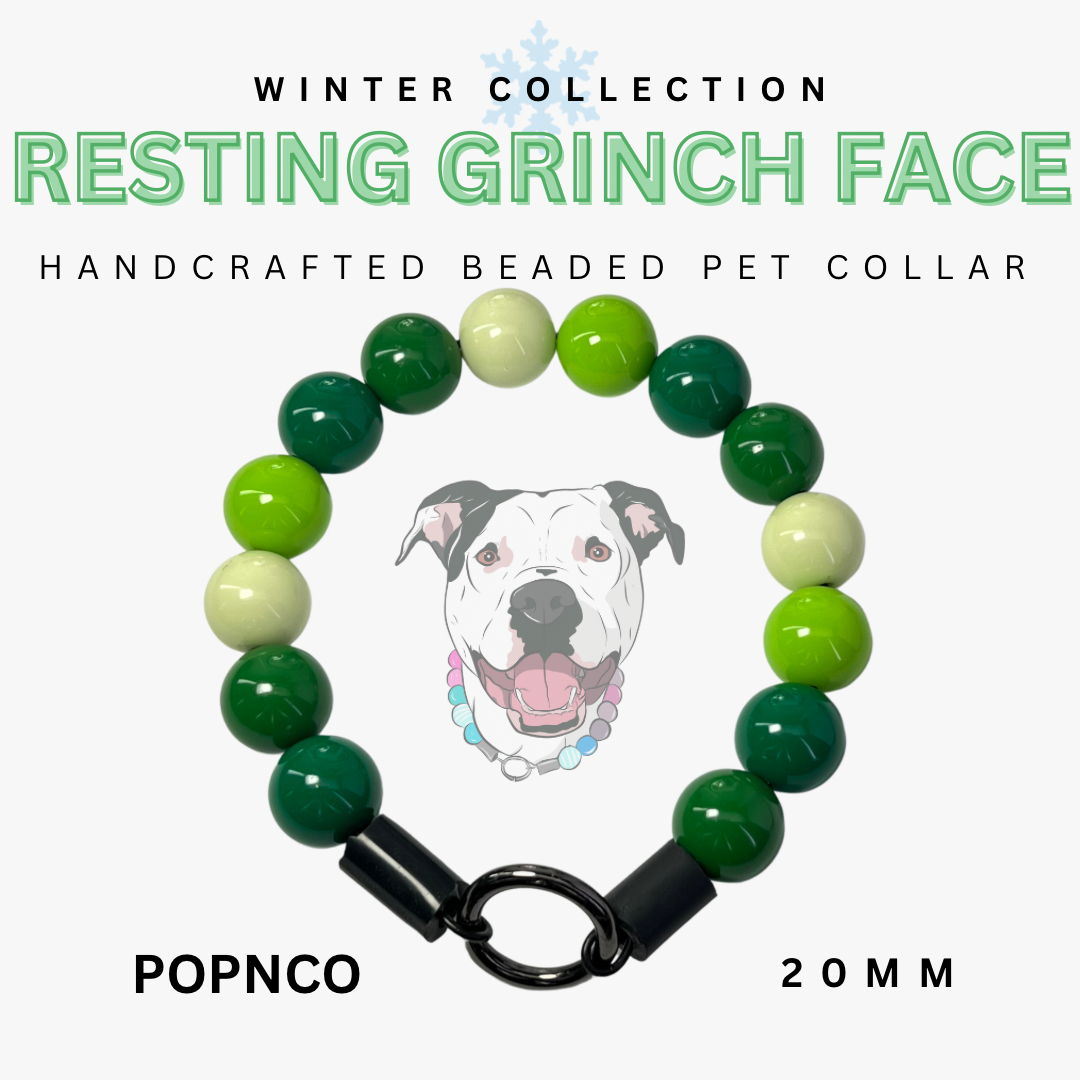 Handcrafted beaded pet collar with green and white beads and a black clasp, featuring a dog illustration and text about the 'Resting Grinch Face' collection.