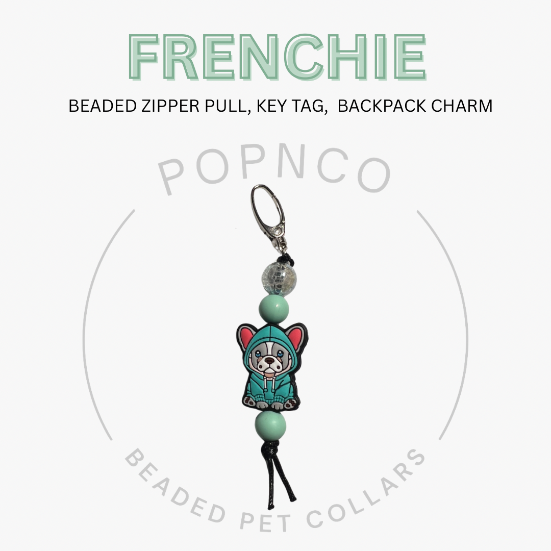 Beaded zipper pull, key tag, or backpack charm with 'FRENCHIE' text and 'POPNCO' branding on a white background.