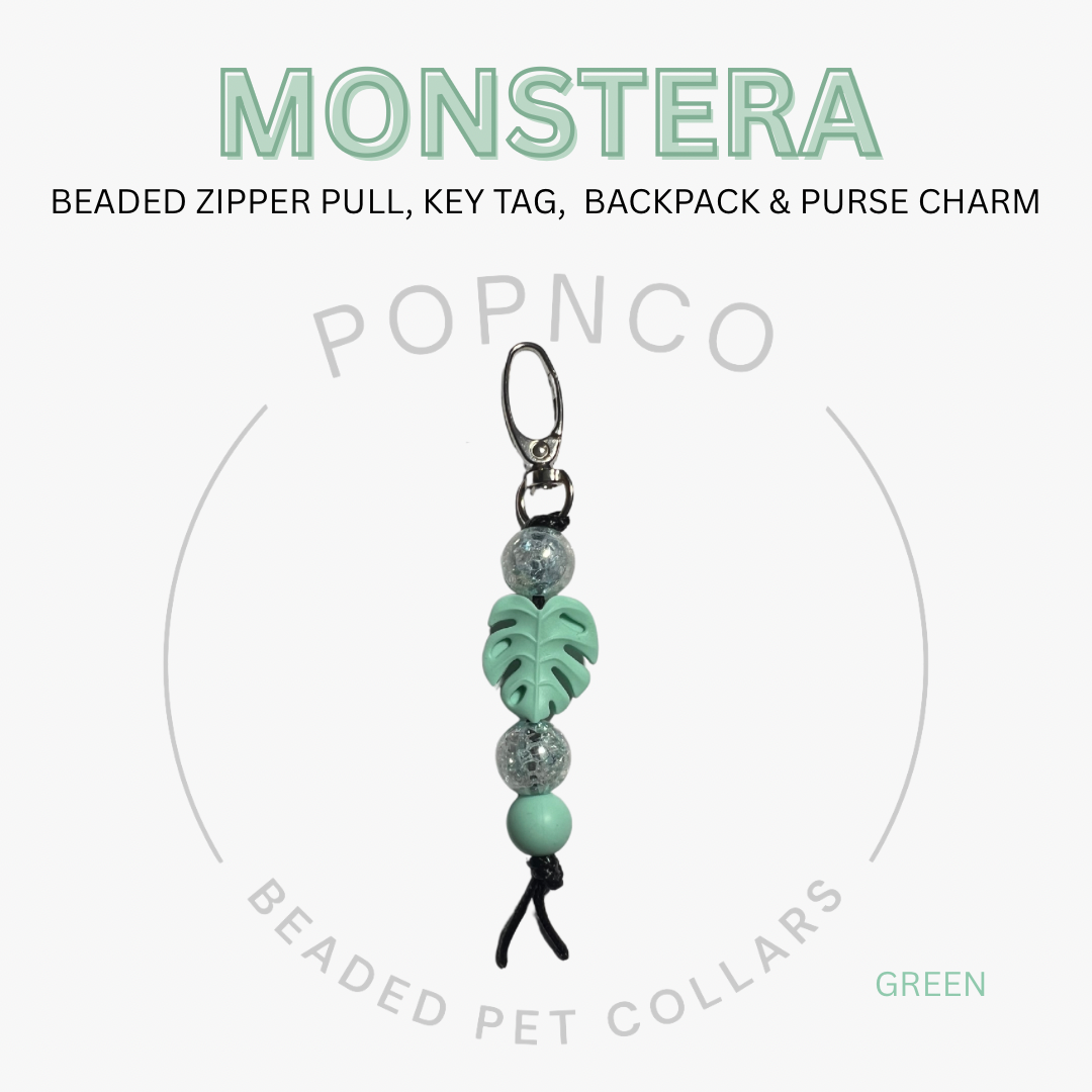 Green beaded zipper pull, key tag, backpack & purse charm with 'Monstera' text on a white background.