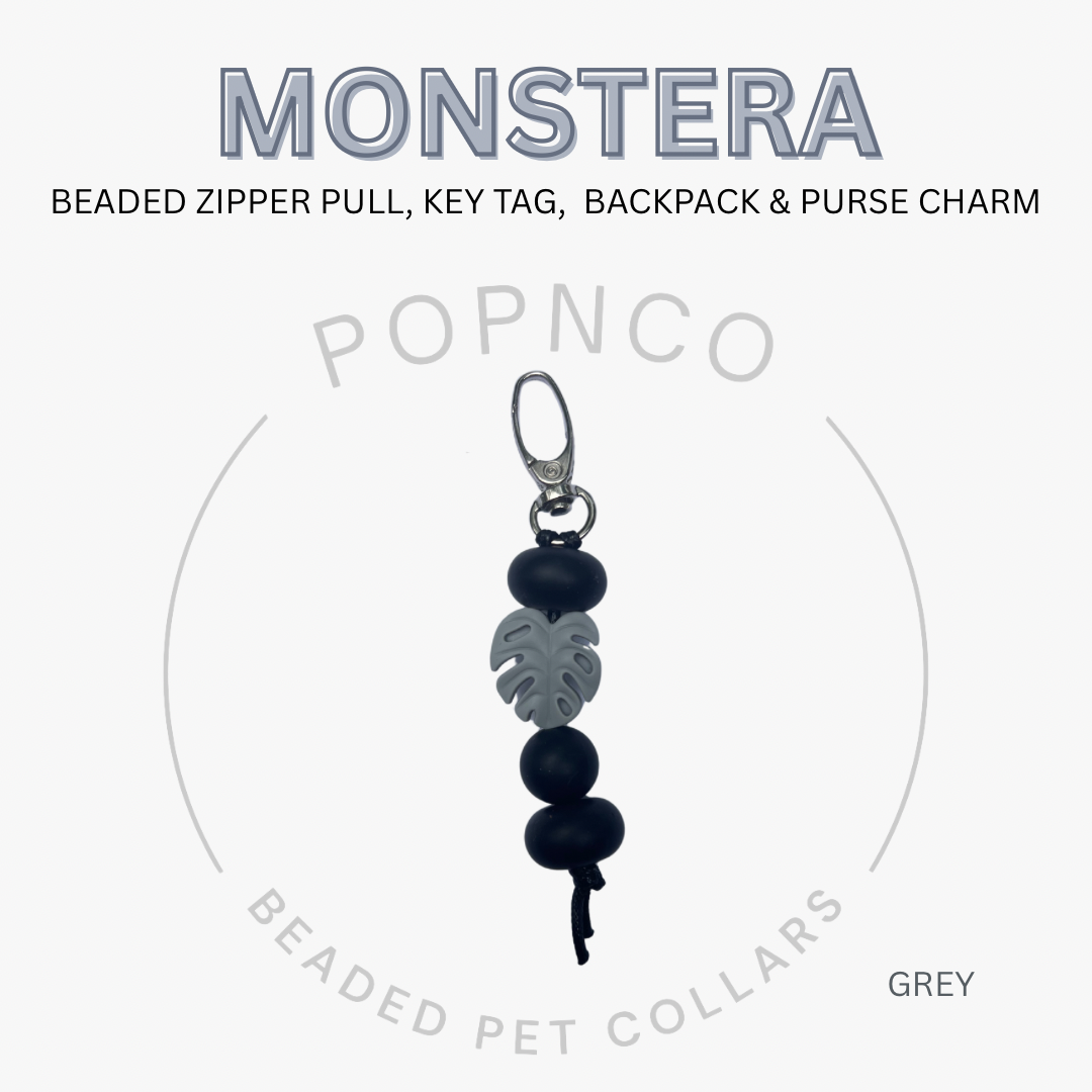 Beaded zipper pull, key tag, backpack & purse charm with 'MONSTERA' branding on a white background.