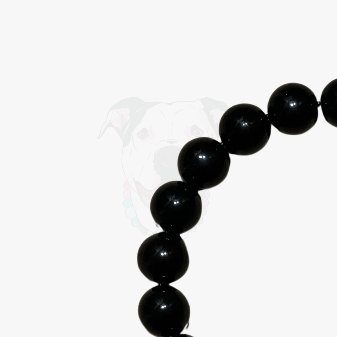 Black beaded bracelet on a white background