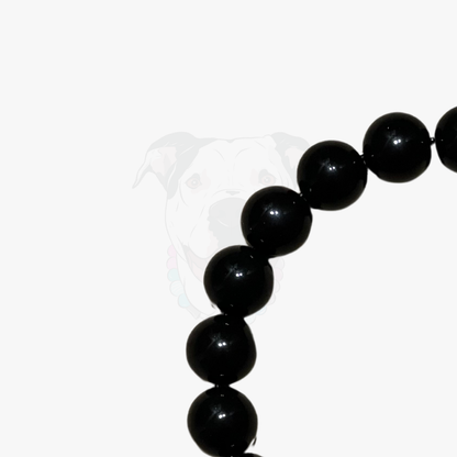 Black beaded bracelet on a white background