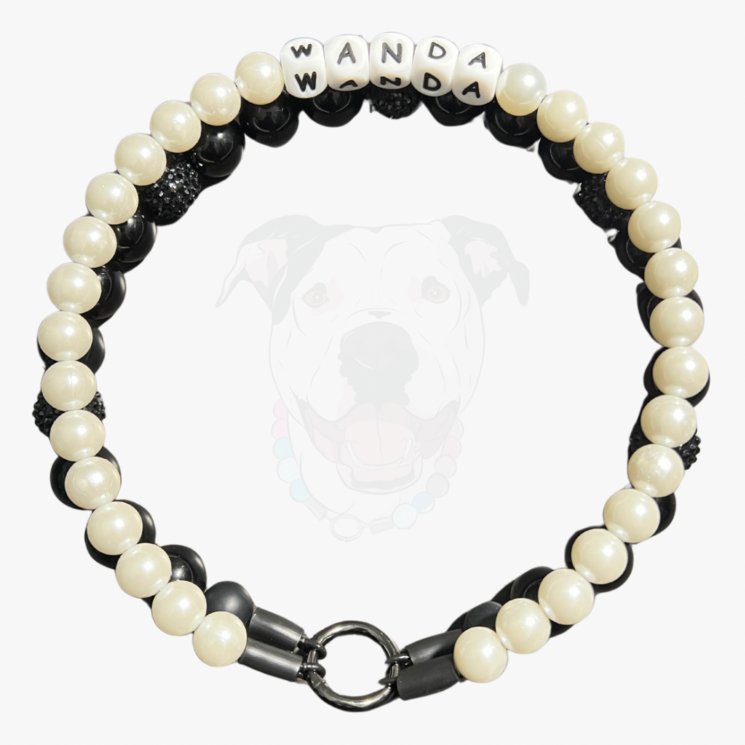 Black and white beaded bracelet with 'WANDA' on a white background POPNCO acrylic bead, acrylic collar, Bead dog collar, beaded collar, Beaded dog collar, Breathable dog collar, cat collar, Comfortable Dog Collar, dog collar, Durable dog collar, Easy to clean dog collar, Easy to clean dog collars, fashion collar, handmade, pearl necklace, Pet accessories, pet collar, popnco, Popnco dog collar, slip on collar, Slip on dog collar, Stylish dog collar
