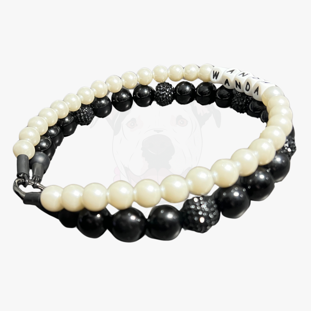Black and white beaded bracelet with 'WANDA' branding on a white background