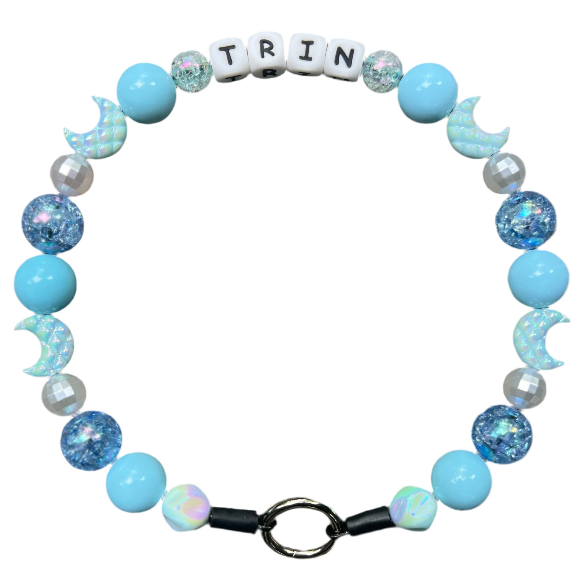 Bracelet with blue and white beads and letter tiles spelling 'TRIN' on a white background