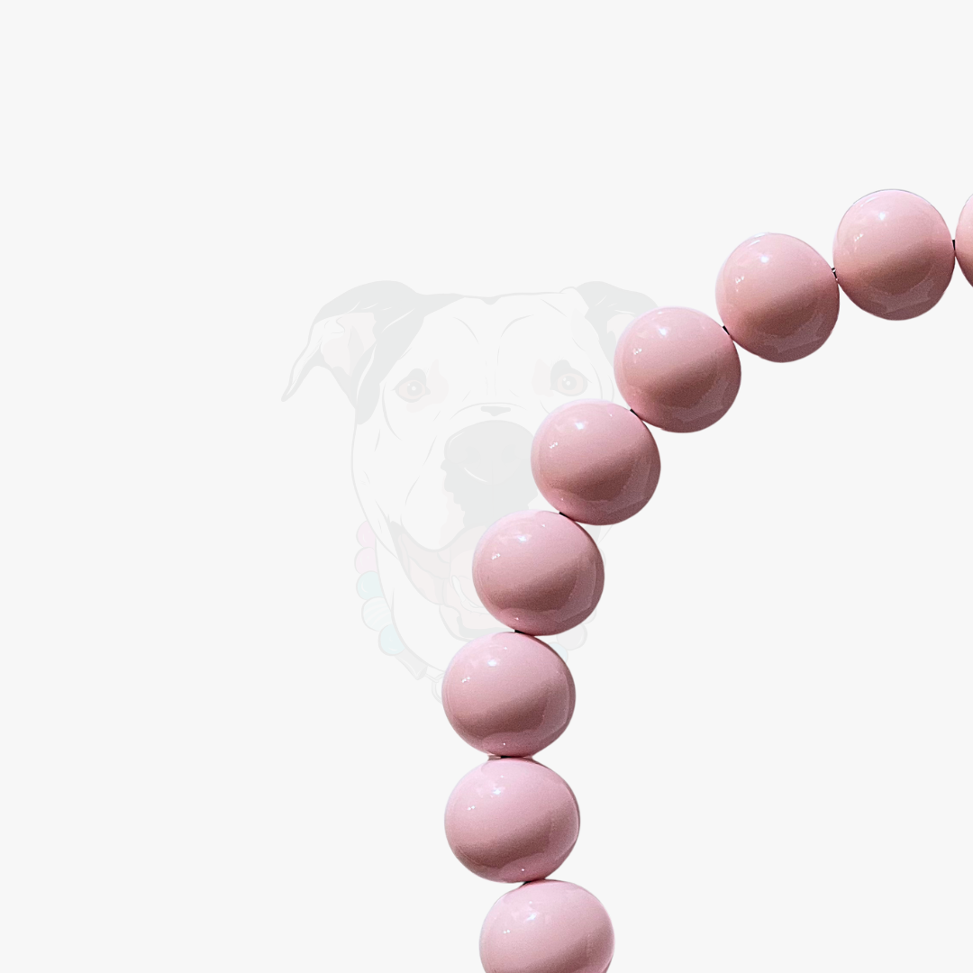 Pink beaded bracelet on a white background