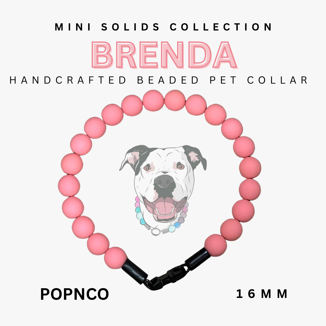 Handcrafted beaded pet collar with pink beads and black clasp, featuring a dog illustration, on a white background.
