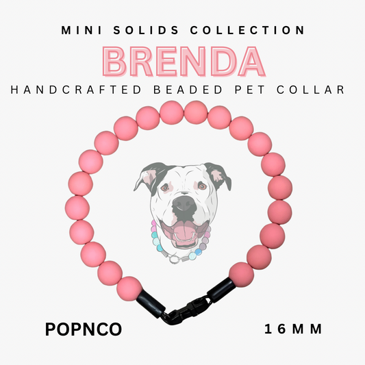Handcrafted beaded pet collar with pink beads and black clasp, featuring a dog illustration, on a white background.