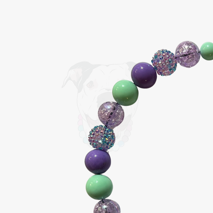Colorful bubblegum bead necklace on a white background