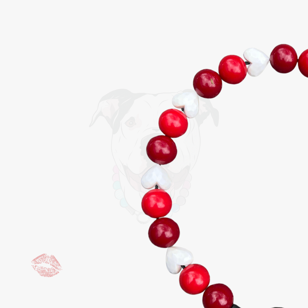 Necklace with red and white beads on a white background