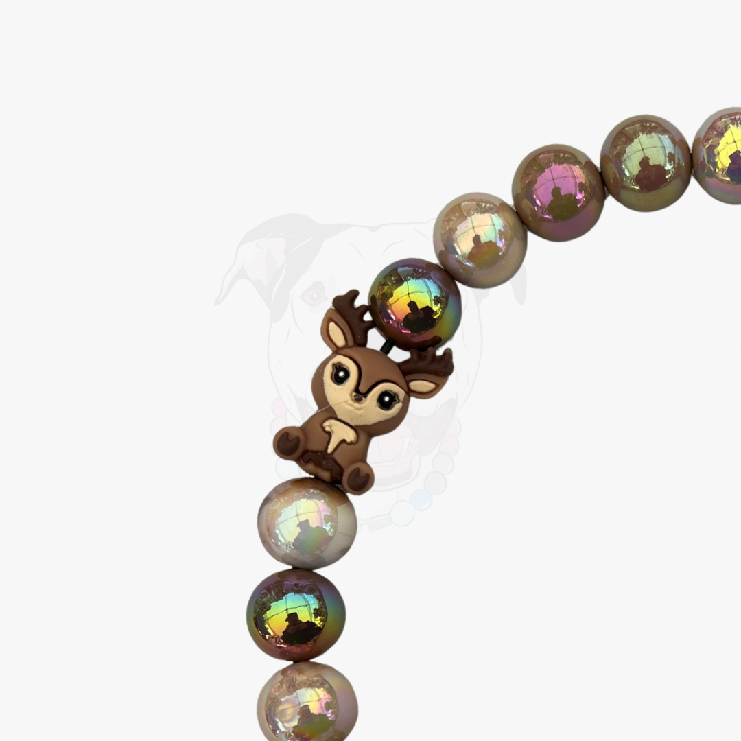 Bracelet with iridescent beads and a deer charm on a white background