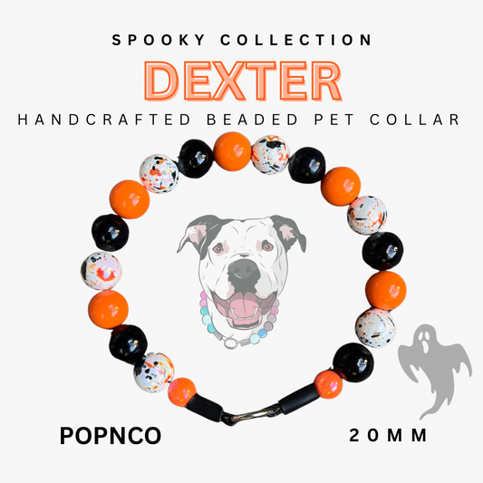 Handcrafted beaded pet collar with Halloween-themed beads on a white background, featuring the brand 'Dexter'.