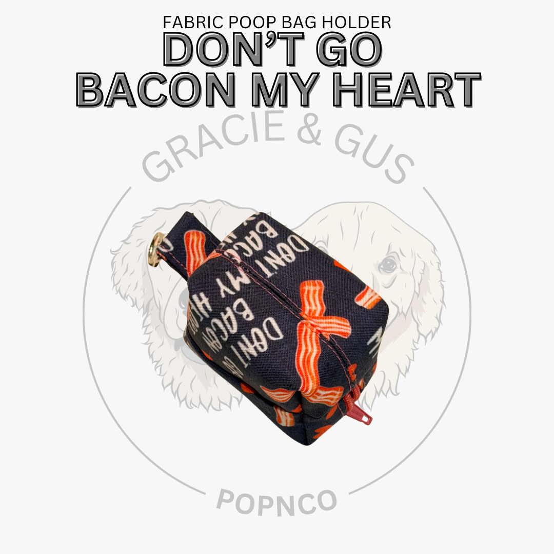 Fabric poop bag holder with bacon pattern and text 'Don't Go Bacon My Heart' on a white background.