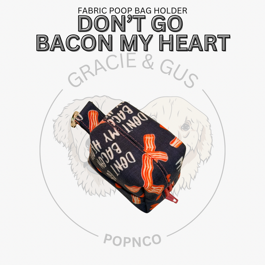 Fabric poop bag holder with bacon pattern and text 'Don't Go Bacon My Heart' on a white background.