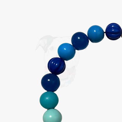 Necklace with blue and green beads on a white background