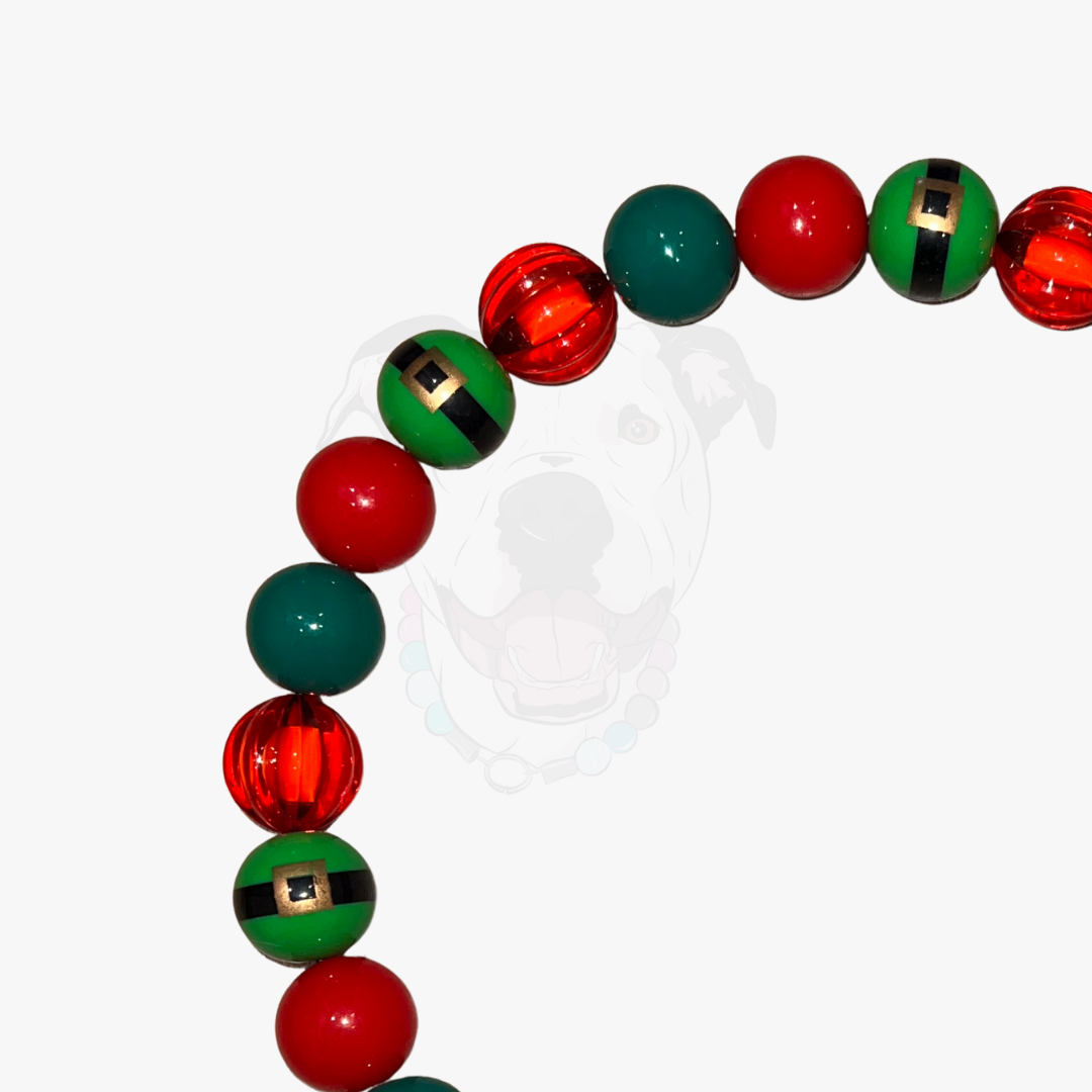 Bracelet with red and green beads on a white background