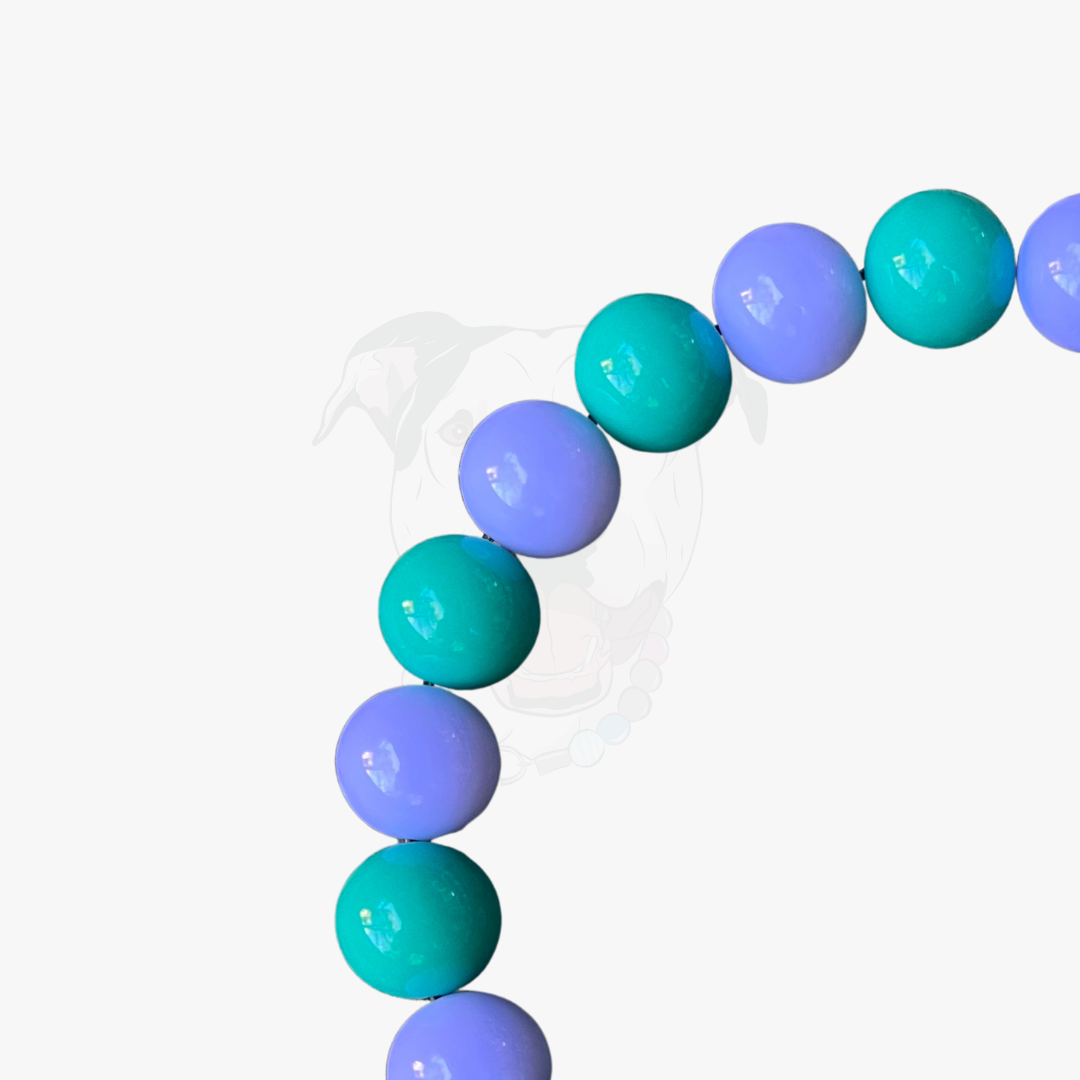 Necklace with teal and purple beads on a white background