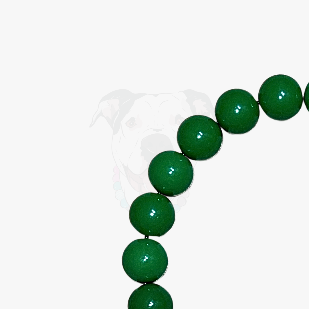 Green beaded necklace on a white background