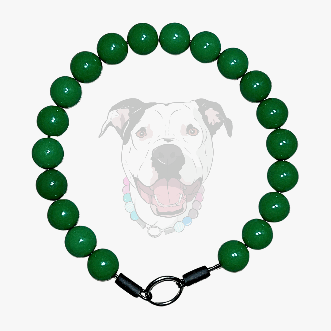 Green beaded dog collar with a dog's face in the center on a white background