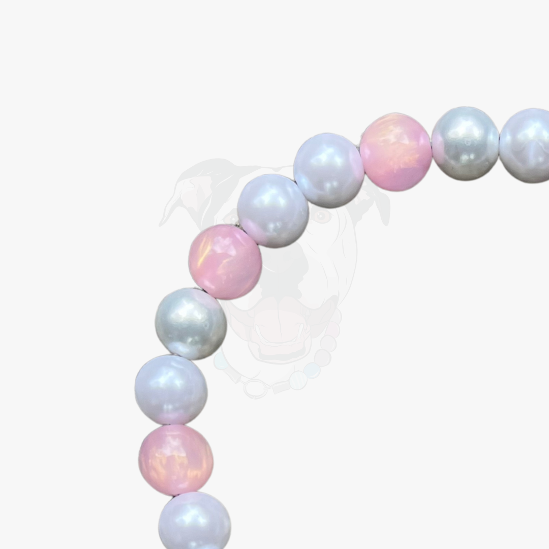 Pastel-colored balloon arch on a white background