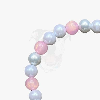 Pastel-colored balloon arch on a white background