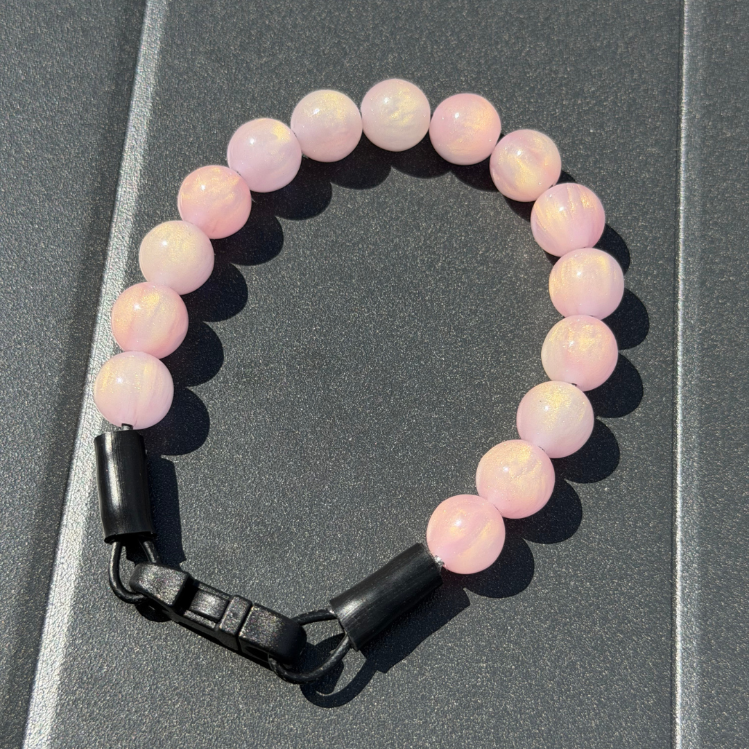Giselle Pink Sparkly Galaxy 12mm  POPNCO beaded collar from the galaxy collection close up on a grey black table