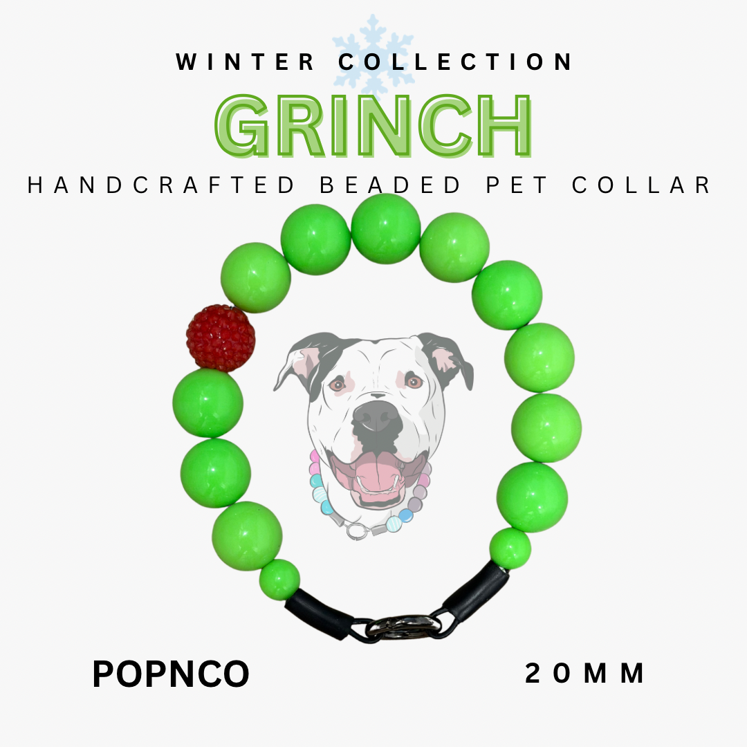 Handcrafted beaded pet collar with green beads and a red accent, featuring a dog illustration and text about the 'Grinch' collection.