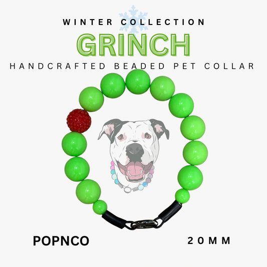 Handcrafted beaded pet collar with green beads and a red accent, featuring a dog illustration and text about the 'Grinch' collection.
