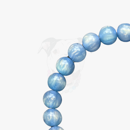 Blue beaded bracelet on a white background