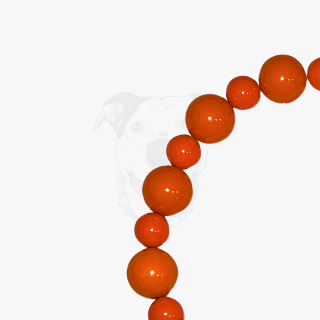Orange beads on a white background
