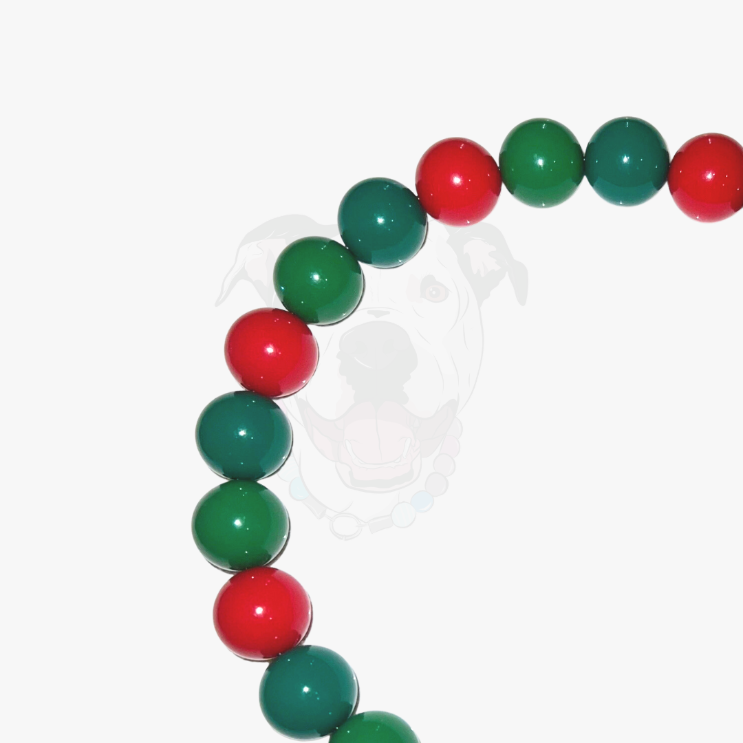 Bracelet with red and green beads on a white background