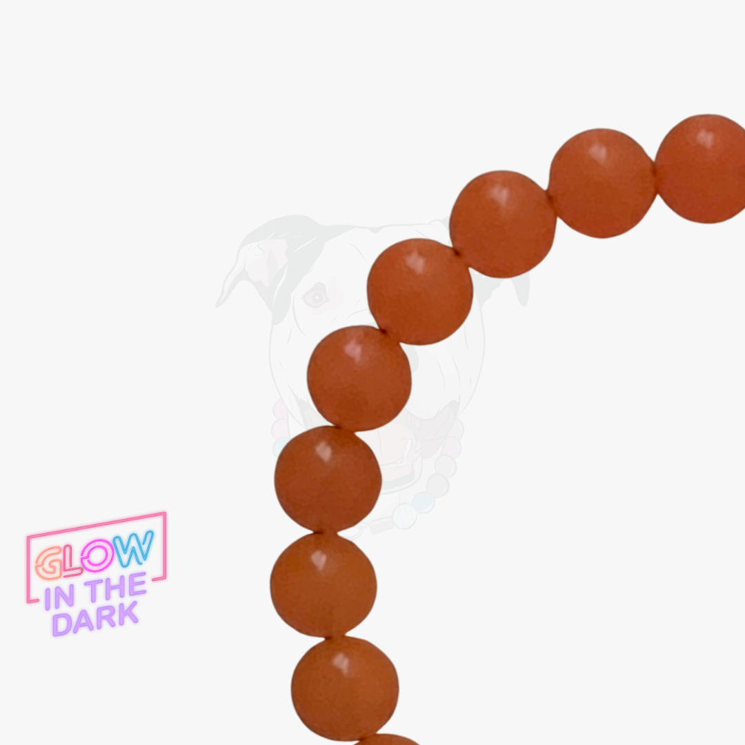 Brown beaded bracelet with 'Glow in the Dark' label on a white background