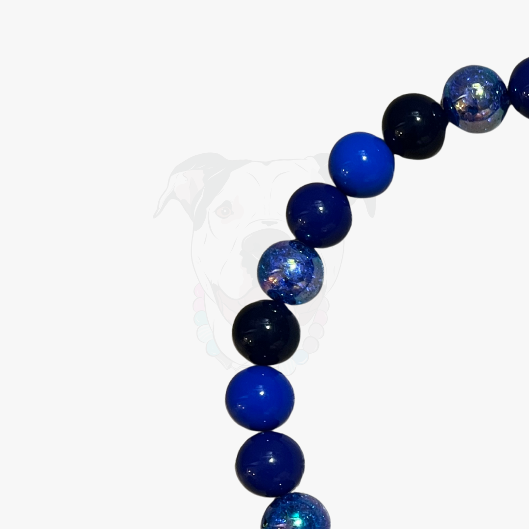 Beaded bracelet with blue and black beads on a white background