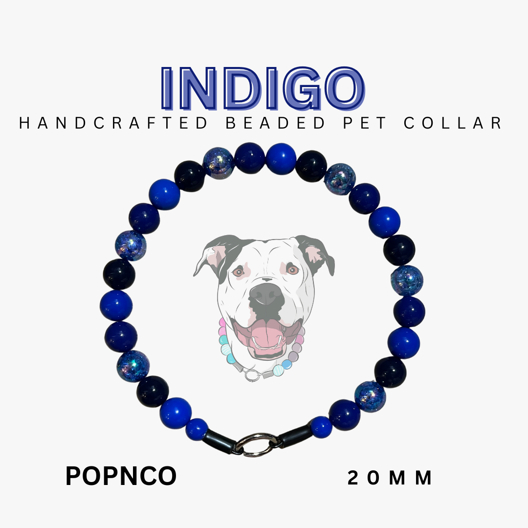 Handcrafted beaded pet collar with blue and black beads on a white background, featuring the brand 'Indigo'.