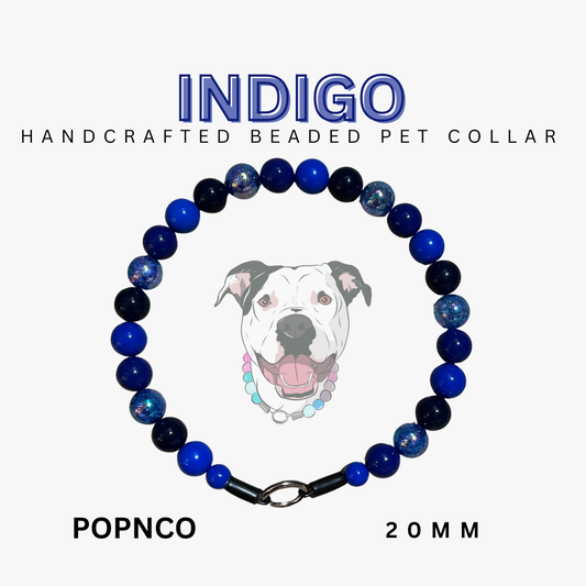 Handcrafted beaded pet collar with blue and black beads on a white background, featuring the brand 'Indigo'.