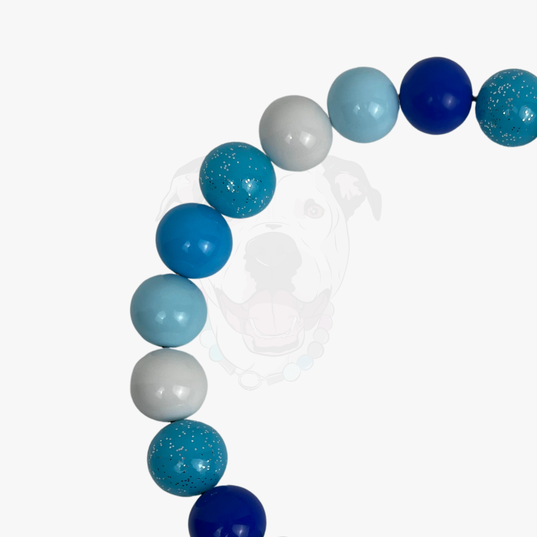 Necklace with blue, gray, and turquoise beads on a white background