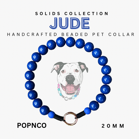 Blue beaded pet collar with 'JUDE' branding on a white background