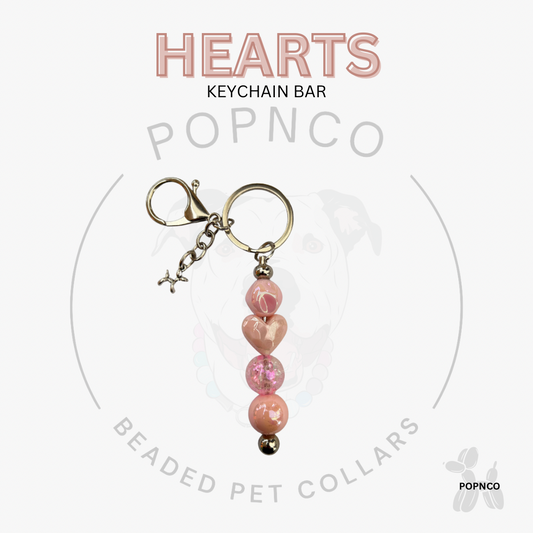 Pink beaded keychain with 'POPNCO' branding on a white background